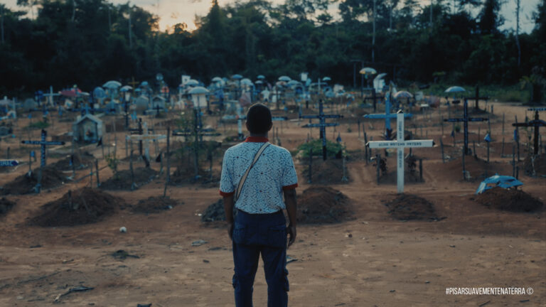José Pepe Manuyama, who is featured in the documentary film "Stepping Softly on the Earth," stands before a graveyard in the Peruvian Amazon. Photo courtesy of Marcos Colón.