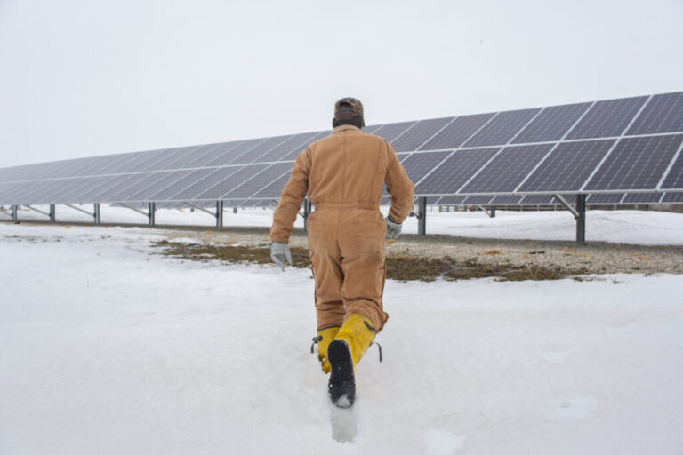 Randy DeBaillie walks toward his solar panels at his farm in Orion, Illinois on Feb. 3, 2019. Credit: Youngrae Kim for The Washington Post via Getty Images