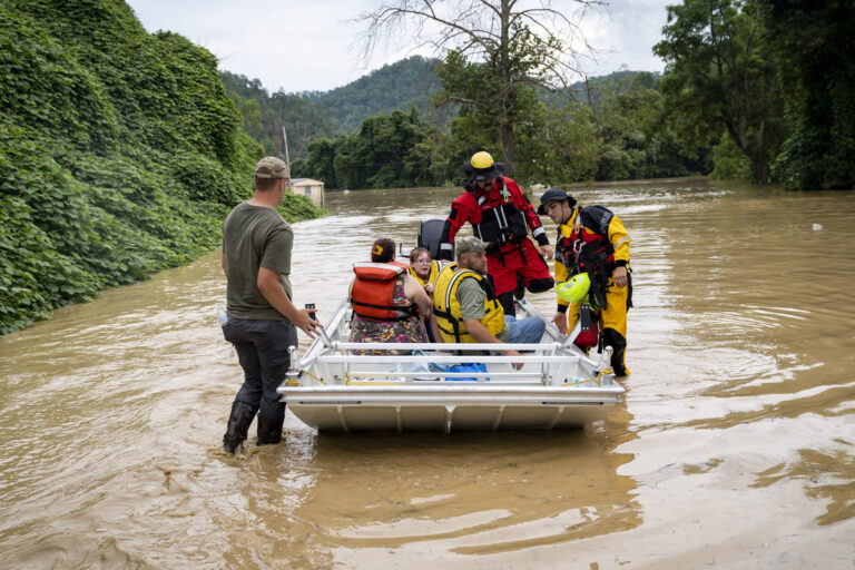 A rescue team from the Jackson Fire Department assists people out of floodwaters downtown on July 28, 2022 in Jackson, Kentucky. Credit: Michael Swensen/Getty Images