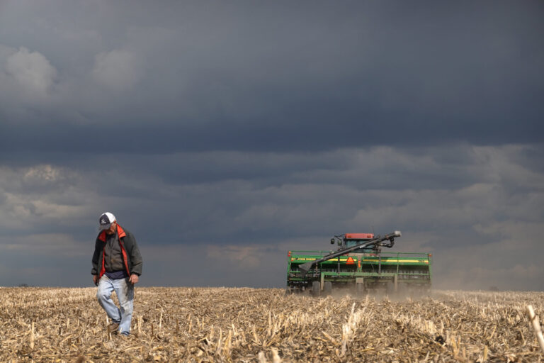 John Duffy walks across a field he is planting in soybeans on April 23, 2020 near Dwight, Illinois. Credit: Scott Olson/Getty Images