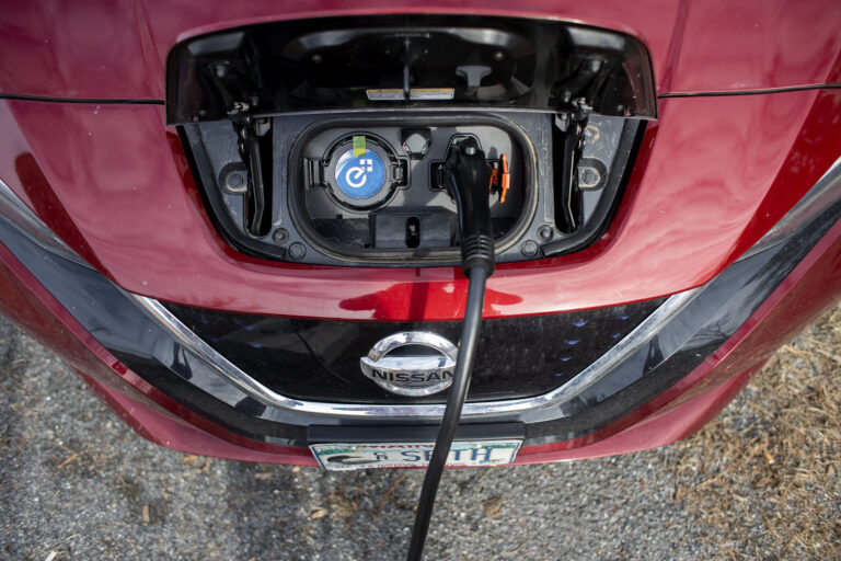 A Nissan Leaf at a EV charging station at Flight Deck Brewing in Brunswick. Credit: Derek Davis/Portland Press Herald via Getty Images