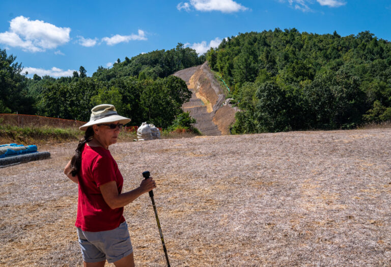 Robinallen Austin, a member of Protect Our Water, Heritage, Rights, (POWHR) overlooks land in the distance where 42 diameter sections of steel pipe have not been buried of the Mountain Valley Pipeline, MVP, on Aug. 31, 2022 in Bent Mountain, Virginia. Credit: Robert Nickelsberg/Getty Images