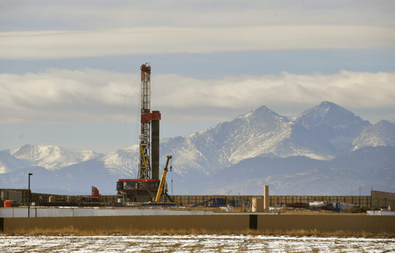 A large fracking operation becomes a new part of the horizon with Mount Meeker and Longs Peak looming in the background on Dec. 28, 2017 in Loveland, Colorado. Credit: Helen H. Richardson/The Denver Post via Getty Images
