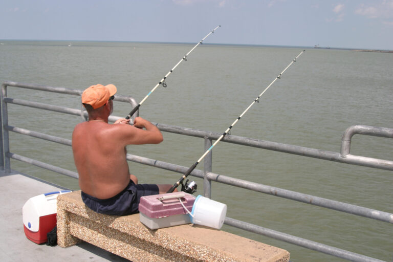 A man fishing from the pier at Edgewater Park. Credit: Jeffrey Greenberg/Universal Images Group via Getty Images