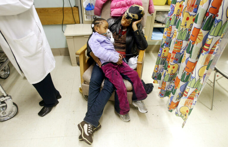 In a file photo, a five-year-old child is treated in a New York City emergency room after an asthma attack. A week ago, the city experienced its highest number of asthma-related ER visits so far in 2023. Credit: Mario Tama/Getty Images.