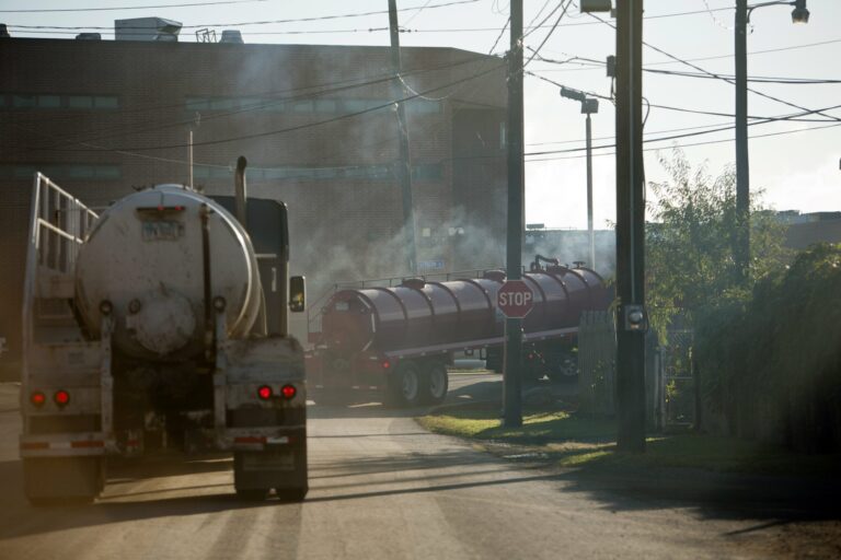 Two 18-wheel tractor trailers carry fresh water to natural gas wells being fracked in Pennsylvania's Marcellus Shale. After injection into the wells at high pressure, wastewater returns to the surface and is either recycled and used to frack other wells, stored above ground, or injected in storage wells below ground. The wastewater typically contains numerous toxic chemicals used in the fracking process as well as natural contaminants, such as arsenic, radium and salts. Credit: Robert Nickelsberg/Getty Images.