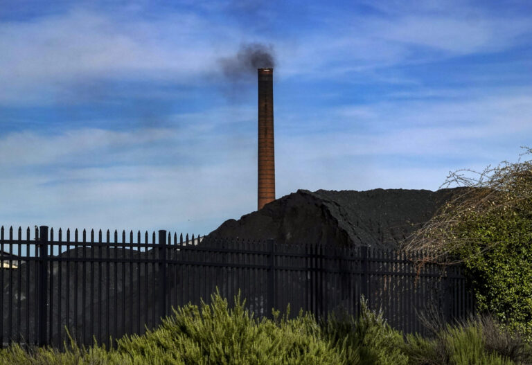 In 2018, a smokestack on the site of then-ERP Coke, within the EPA's 35th Avenue Superfund site in north Birmingham, Alabama. The facility was sold in 2019 to the family of West Virginia Gov. Jim Justice, and is now called Bluestone Coke. The facility temporarily ceased operations in 2021, but still owes the Jefferson County Health Department almost $300,000 in fines and penalties for air pollution violations. Credit: Bonnie Jo Mount/The Washington Post via Getty Images