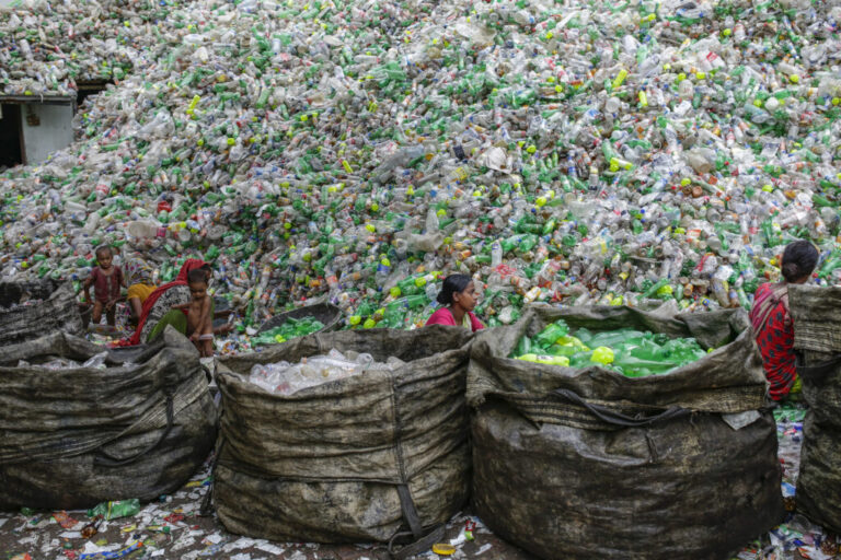 Female workers sort out plastic bottles for recycling in a factory in Dhaka, Bangladesh in October 2016. Plastic not only poses an immense pollution problem—it also exacerbates climate change. If plastic production stays on its current trajectory, by 2030, greenhouse gas emissions from plastics could reach 1.34 billion tons per year, equivalent to the emissions produced by 300 new 500MW coal-fired power plants. Credit: Abir Abdullah / Climate Visuals Countdown