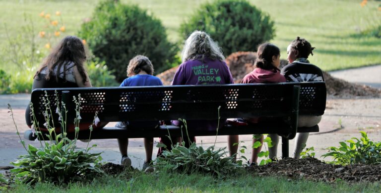 Volunteers on a park bench.
