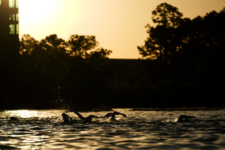 A stock photo of a man swimming.