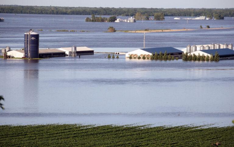 A farm in Iowa is surrounded by flood water. Credit: Scott Olson/Getty Images.