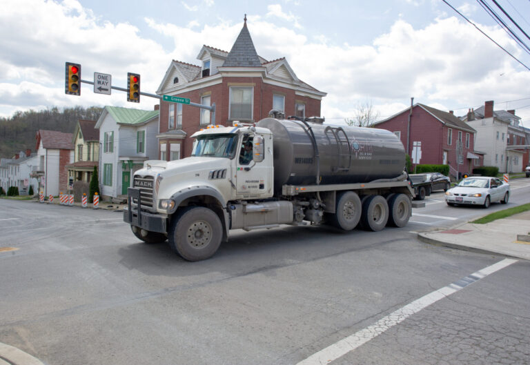 A waste water tank truck passes on the main street of Waynesburg, Pennsylvania. Credit: Mladen Antonov/AFP via Getty Images.