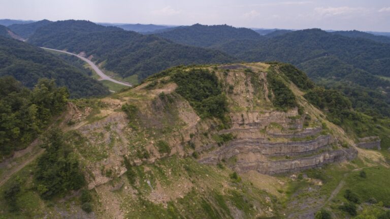 The side of the mountain shows the effects of strip mining where Tracy Neece’s cousin owns property. A former strip mining operation failed to reclaim the land as promised. Credit: Alton Strupp and Michael Clevenger/The Courier Journal