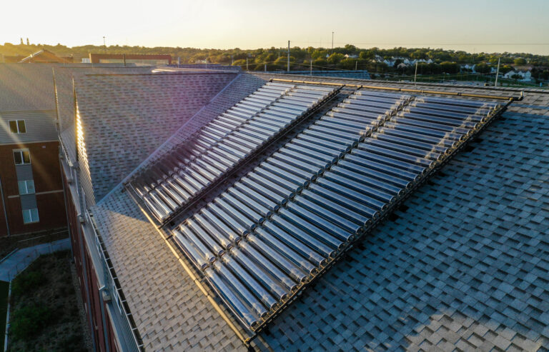 The solar water heating system at Creighton University absorbs heat and then transfers it to a water storage tank in the building. Pictured is one of two groups of solar collectors on the roof. Credit: Naked Energy