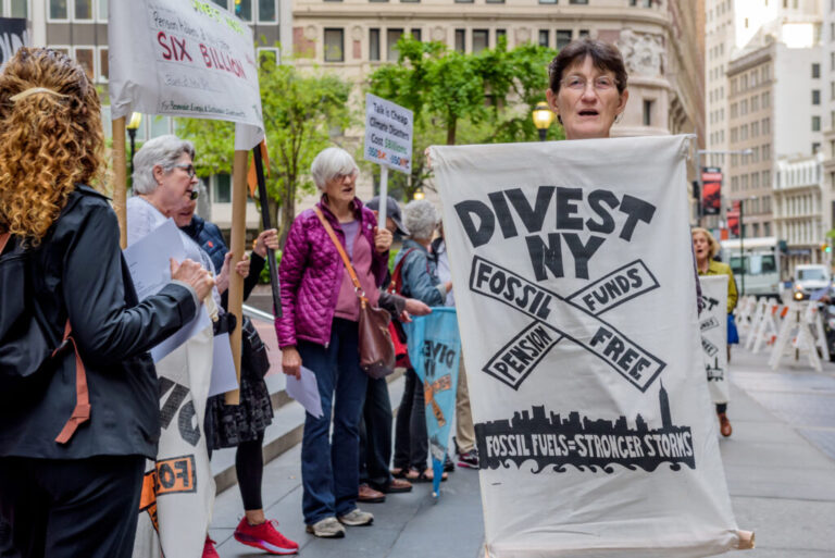 Fossil Free Divest NY, in coordination with community members, rally outside the office of the New York State Comptroller in New York City on May 14, 2018. Credit: Erik McGregor/LightRocket via Getty Images