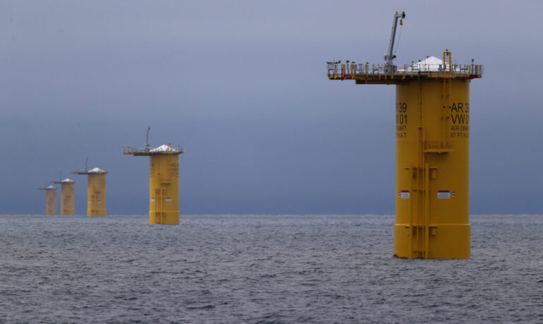 A row of mono piles that will be the base for offshore wind turbines near New Bedford, Mass. Credit: David L Ryan/The Boston Globe via Getty Images