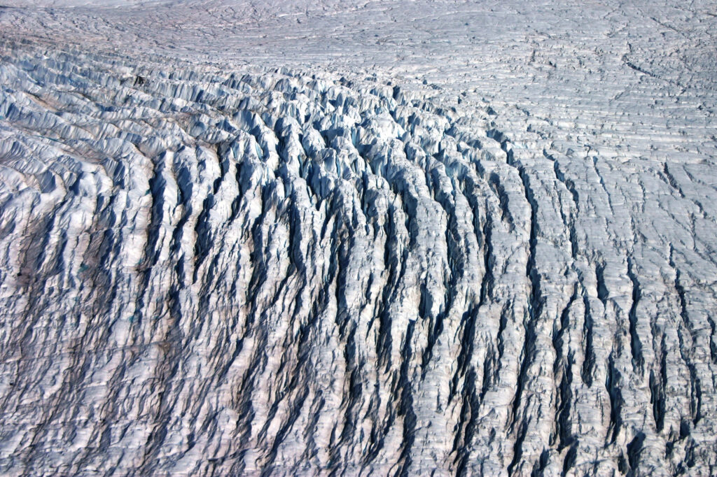 Crevasses upstream of the terminus of the Jakobshavn Isbræ (Sermeq Kujalleq) Glacier in west-central Greenland, a region where a new study shows a significant spread of crevasses. Photo courtesy William Colgan, Geological Survey of Denmark and Greenland.