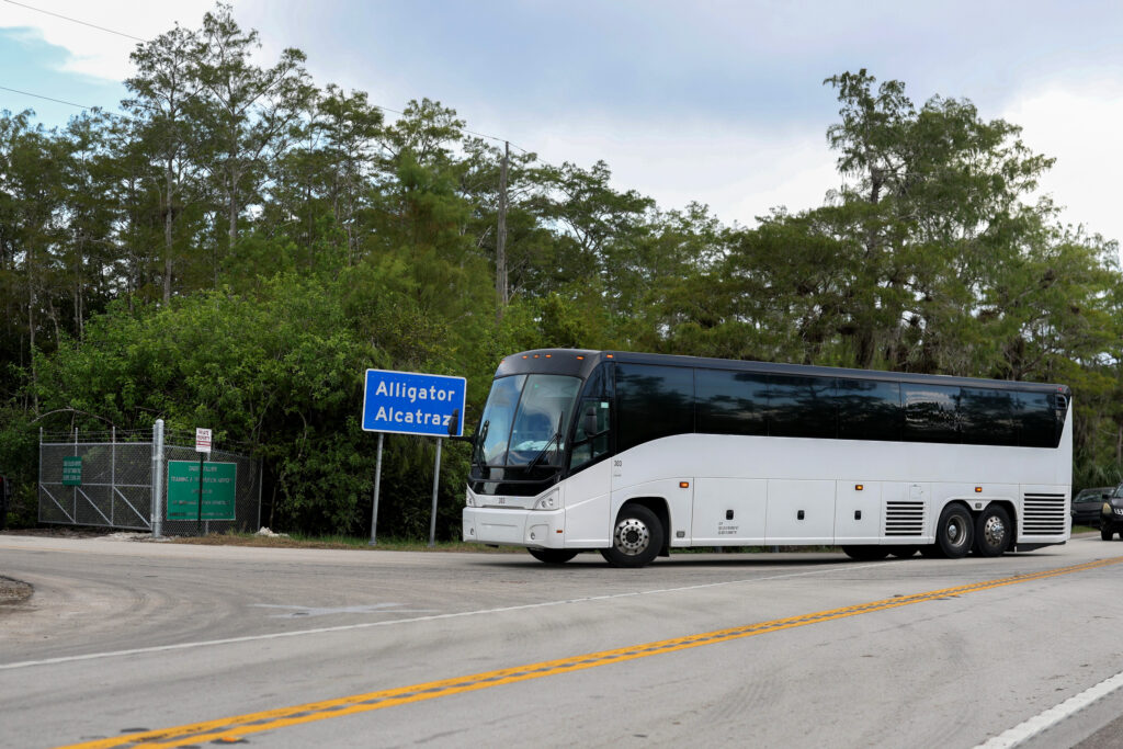A bus pulls into the entrance to the immigration detention center dubbed Alligator Alcatraz in the Florida Everglades on Aug. 3 in Ochopee, Fla. Credit: Joe Raedle/Getty Images