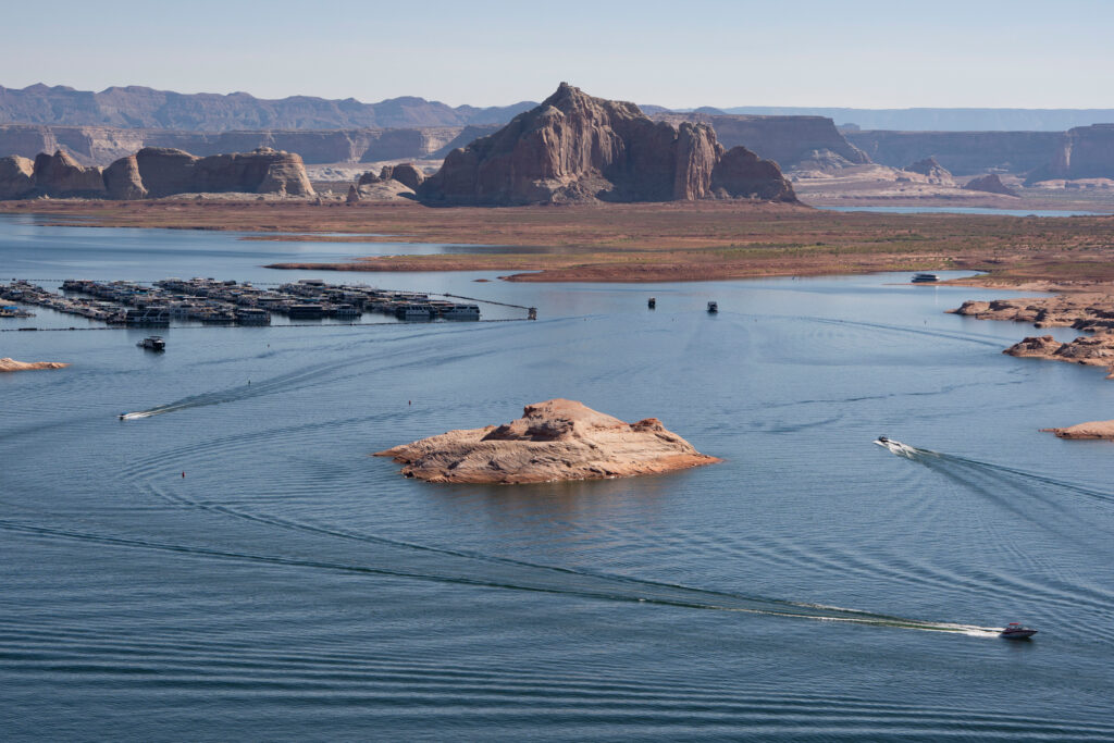 Boaters cruise across Lake Powell in Glen Canyon National Recreation Area on July 10 in Page, Ariz. Credit: Rebecca Noble/Getty Images