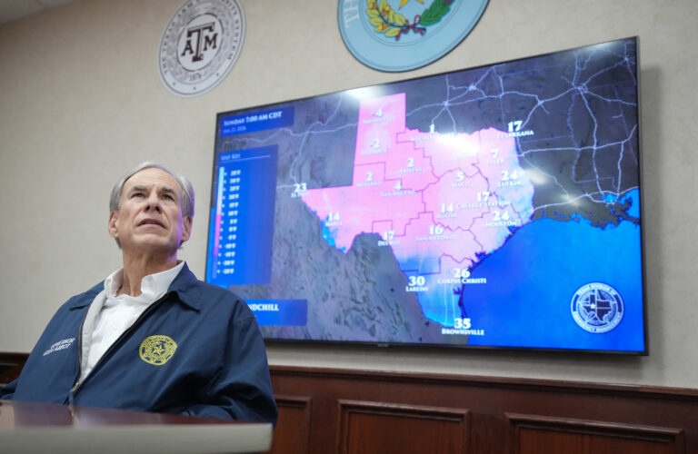 Texas Gov. Greg Abbott listens to a briefing as he prepares for a winter storm at the State Operations Center in Austin. Credit: Jay Janner/The Austin American-Statesman via Getty Images