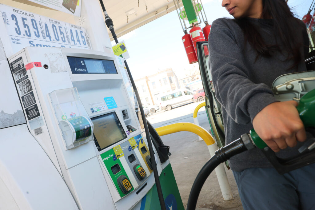 A person pumps gas at a BP station on Tuesday in the Kensington neighborhood of Brooklyn in New York City. Michael M. Santiago/Getty Images