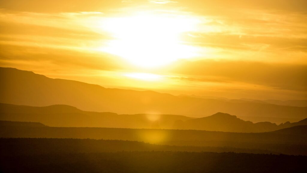 Sun Shining Over a Mountain Range