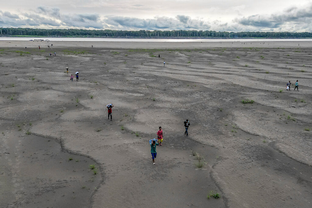 The 2024 El Niño in the Tropical Pacific, combined with human-caused warming, dried out vast tracts of the Amazon region, crushing livelihoods and displacing people, and also flipped some forests to release more carbon dioxide than they absorb and store, a “regime shift” in the Amazon carbon cycle. Credit: Luis Acosta/AFP via Getty Images