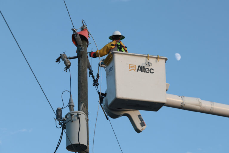 A utility worker with Florida Power & Light services a transformer in Punta Gorda, Fla., on Oct. 12, 2024. Credit: Thomas O'Neill/NurPhoto via Getty Images