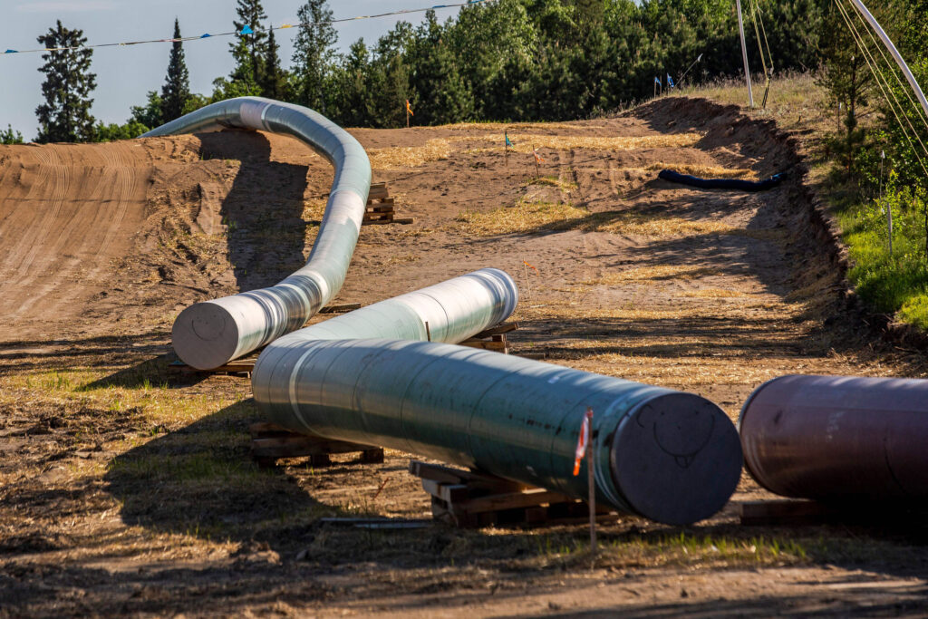 Sections of the Enbridge Line 3 oil pipeline are seen at the construction site near Wauburn, Minn., on June 5, 2021. Credit: Kerem Yucel/AFP via Getty Images