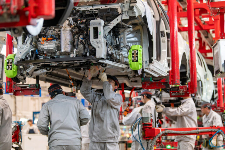 Workers assemble electric vehicles on Jan. 13 at a factory in Zhejiang, China. Credit: VCG via Getty Images