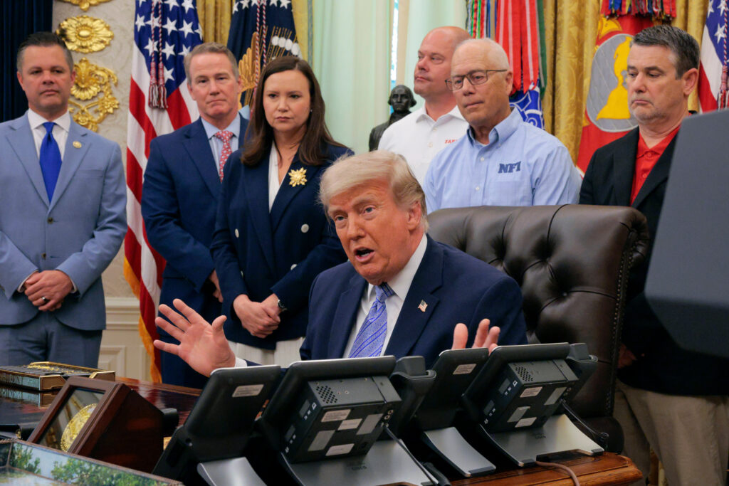 President Donald Trump is joined by grocery store owners and supermarket corporation executives as he announces regulatory rollbacks on chemical refrigerants at the White House on May 21. Credit: Chip Somodevilla/Getty Images
