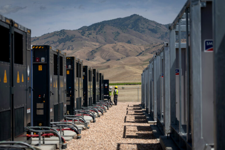 Workers are seen at the Pastoria Battery Energy Storage System facilities on April 16 in Arvin, Calif. Credit: Eric Thayer/Los Angeles Times via Getty Images
