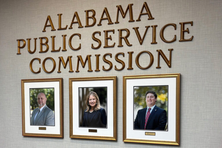 Photos of current Alabama Public Service Commissioners hang in the PSC offices. Chris Beeker (right) lost his reelection bid against Republican opponent Jim Zeigler. Credit: Dennis Pillion/Inside Climate News
