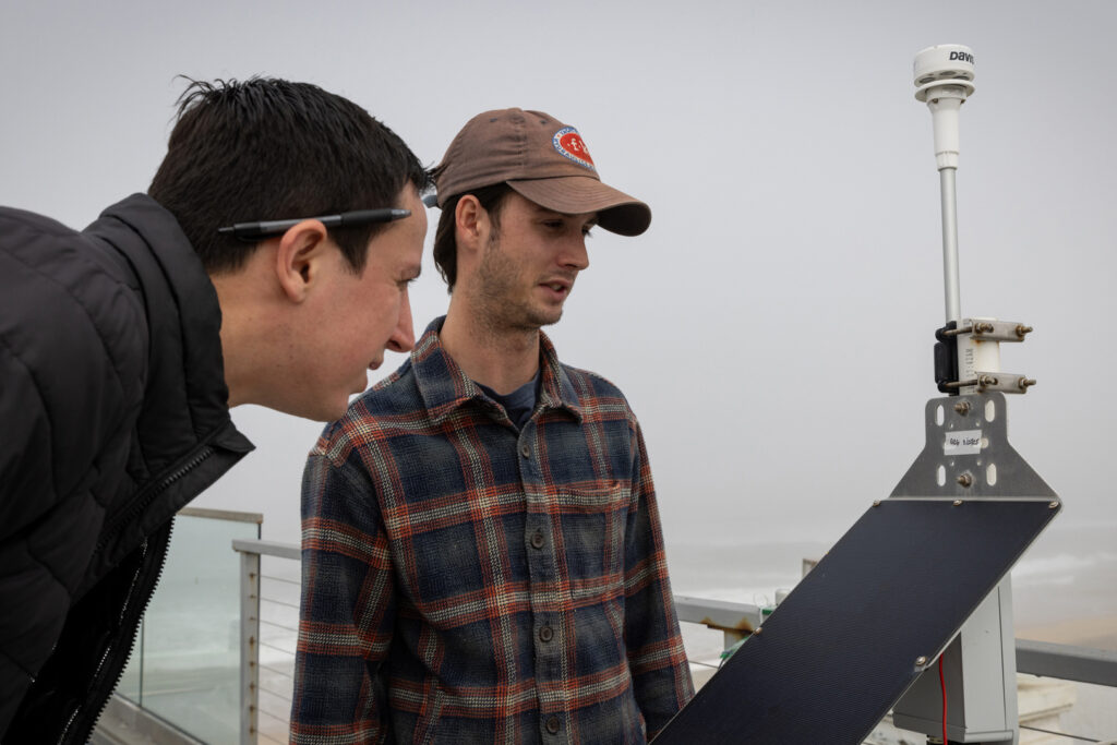Researchers look at an air quality monitor on April 10, 2025, in Imperial Beach, Calif. Credit: Ana Ramirez/The San Diego Union-Tribune via Getty Images